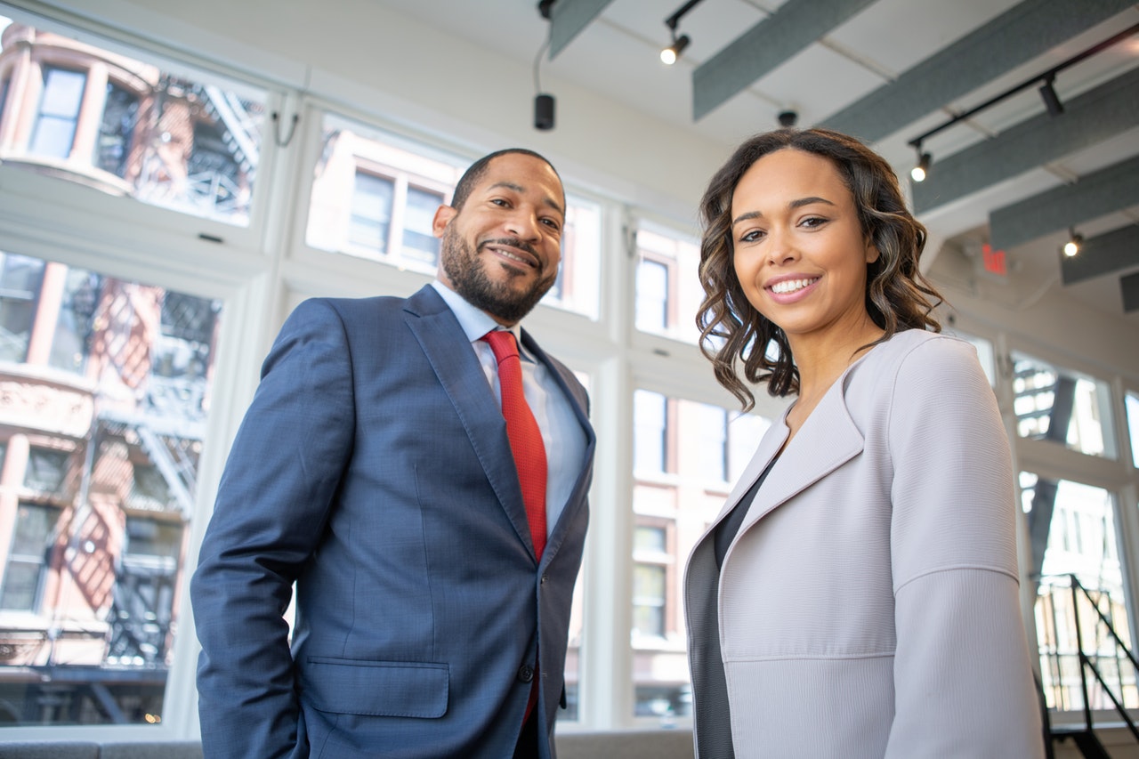 man-and-woman-smiling-inside-building-1367269.jpg